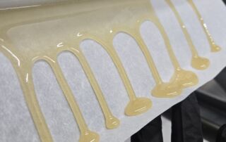 rosin flowing off the rosin presss